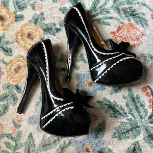 Platform bow pleaser heels